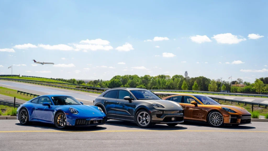 Porsche car price comparison showing Porsche 911, Cayenne, and Taycan models parked on road with luxury design and performance features