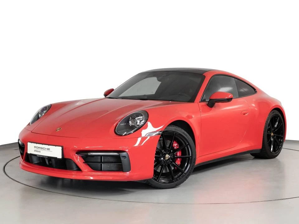 Porsche car price in India featuring red Porsche 911 sports car with sleek design, premium build, and high performance styling